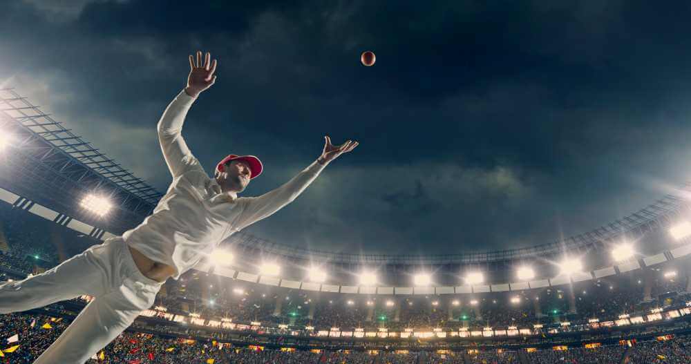 Cricket Player Catching the Ball